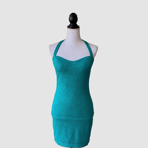 OFF  BEBE TEAL BODYCON RIBBED CUTOUT MINI DRESS - Picture 7 of 15